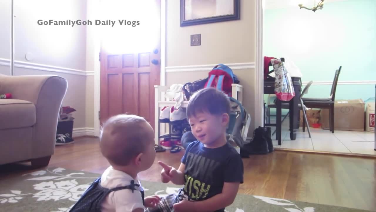 Precious toddler stops crying baby with kiss