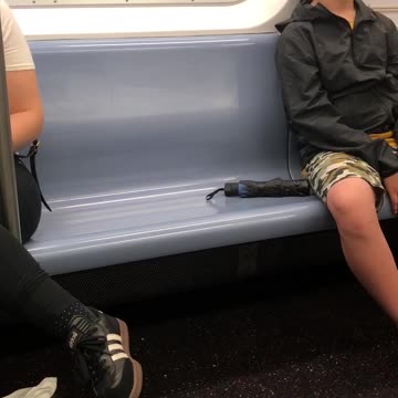 Man with glasses falling asleep on train