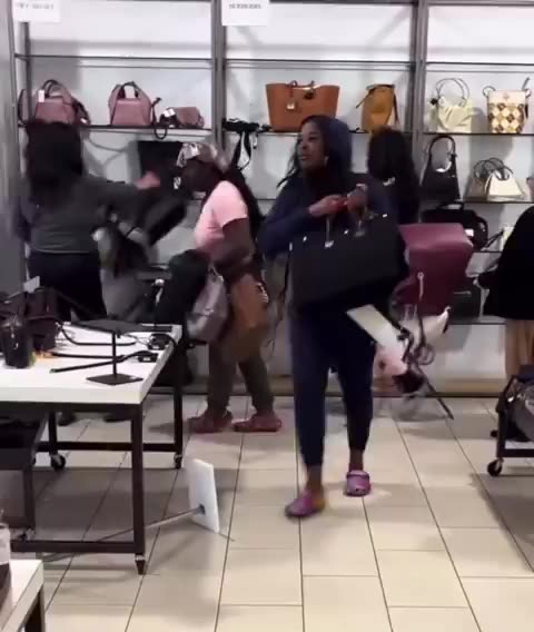 A group of women shoplifting at the Outlets at Orange in Orange, California,
