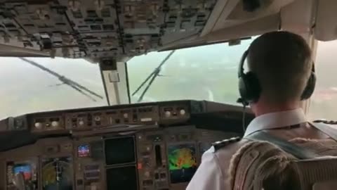 Pilot lands in turbulent weather with low visibility and rain