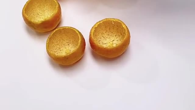 miniature glass and teapot made of orange peel