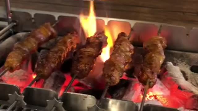 Two men ate lamb skewers in Seoul