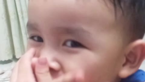 The 3-year-old boy sway to the beat of the music while eating