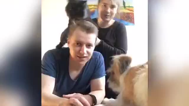 Guy fails at taking a picture of himself and pets