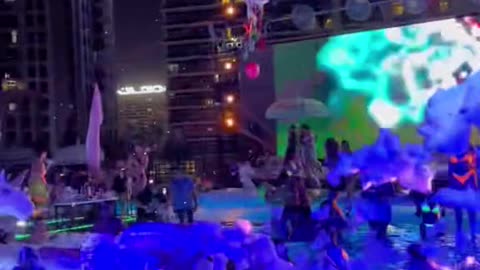 Dubai sky view top floor swimming pool party