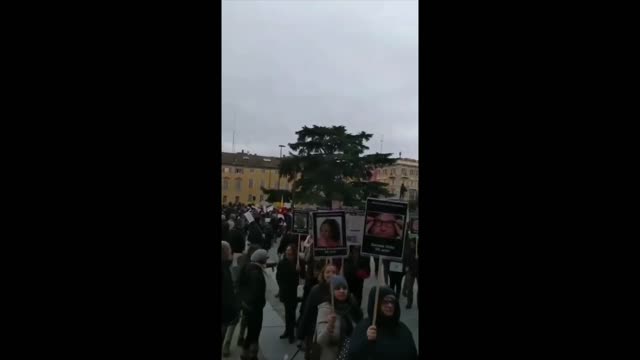 MARCH OF THE VACCINE DEAD: People march with photos of their loved ones killed by the Covid vaccines