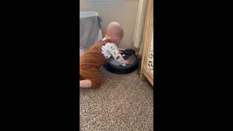 Baby turns on robot vacuum, immediately regrets it