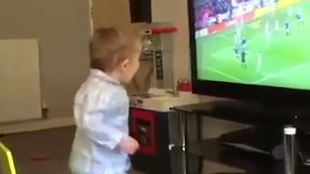 Most adorabele wee soccer fan celebrates a goal by the Glasgow Rangers