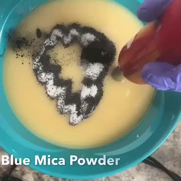Mixing colorant into soap batter
