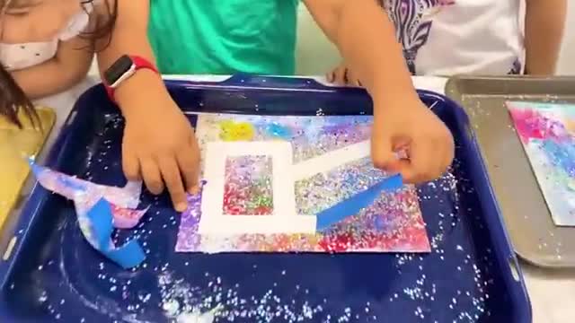 children paint on canvas and surprise teachers