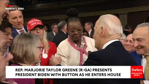 Marjorie Taylor Greene Holds Pin In Front Of Biden As He Enters House Chamber For State Of The Union