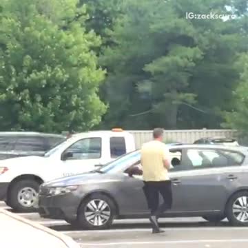 Man in yellow shirt black wet suit half on