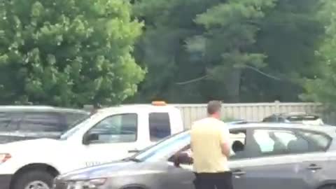 Man in yellow shirt black wet suit half on