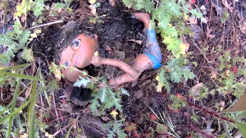 Burned doll at homeless camp