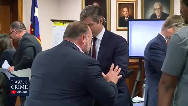 Mother of Sandy Hook Victim Hands Alex Jones Water