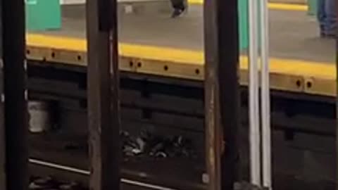 Man dances by himself across subway station