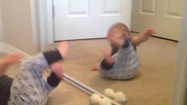 Watch this new baby in the mirror? baby does not recognise reflection after