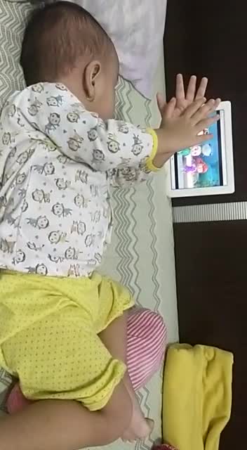 This kid is adorable as he imitates the actions he sees