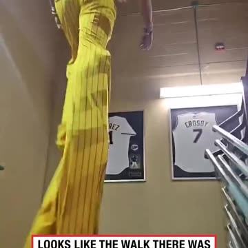 Walking through ballpark on stilts