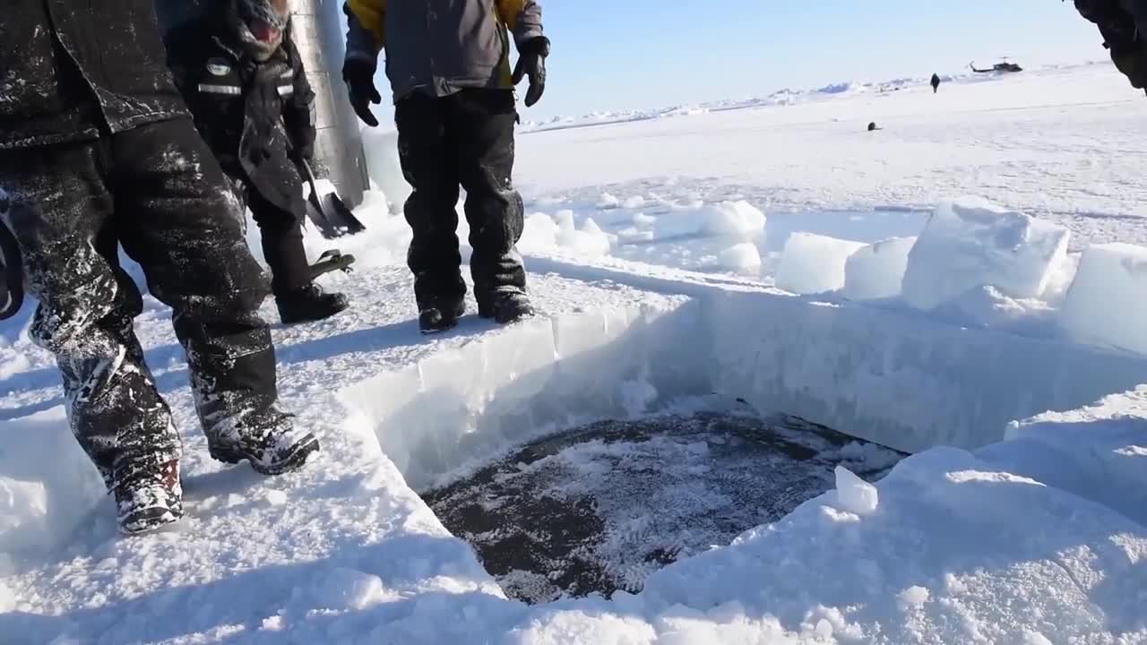 Stunning footage shows US submarine breaking through Arctic ice