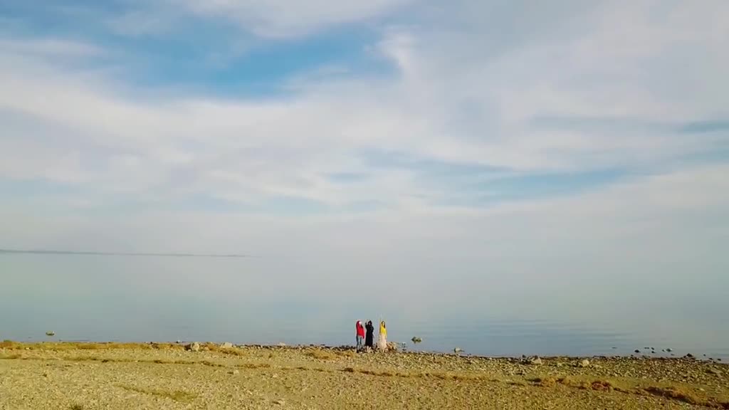 Girls posing beside river