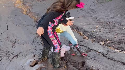 Muddy Riverbank Causes Family Mess