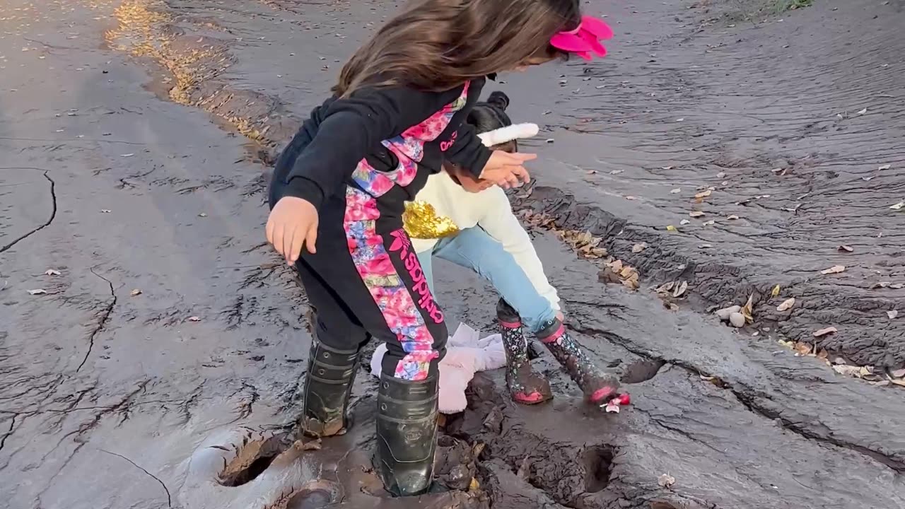 Muddy Riverbank Causes Family Mess