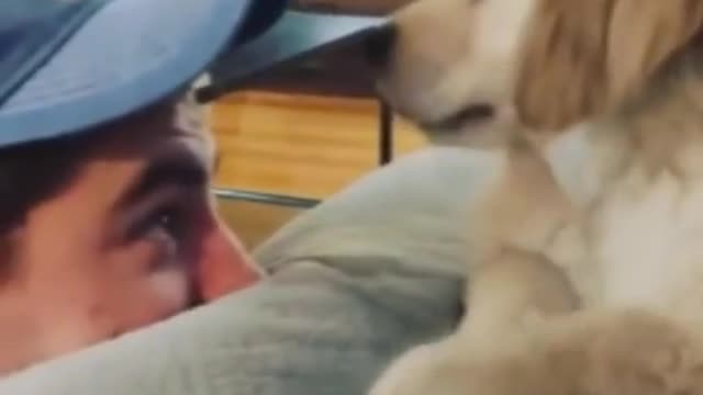 Guy playing with cute puppy