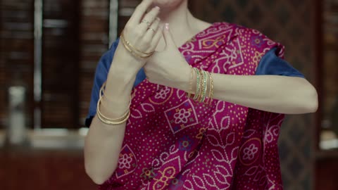 Woman dances doing movements with her hands