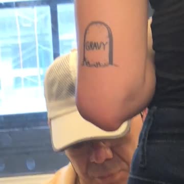 Person tattoo arm tombstone gravy