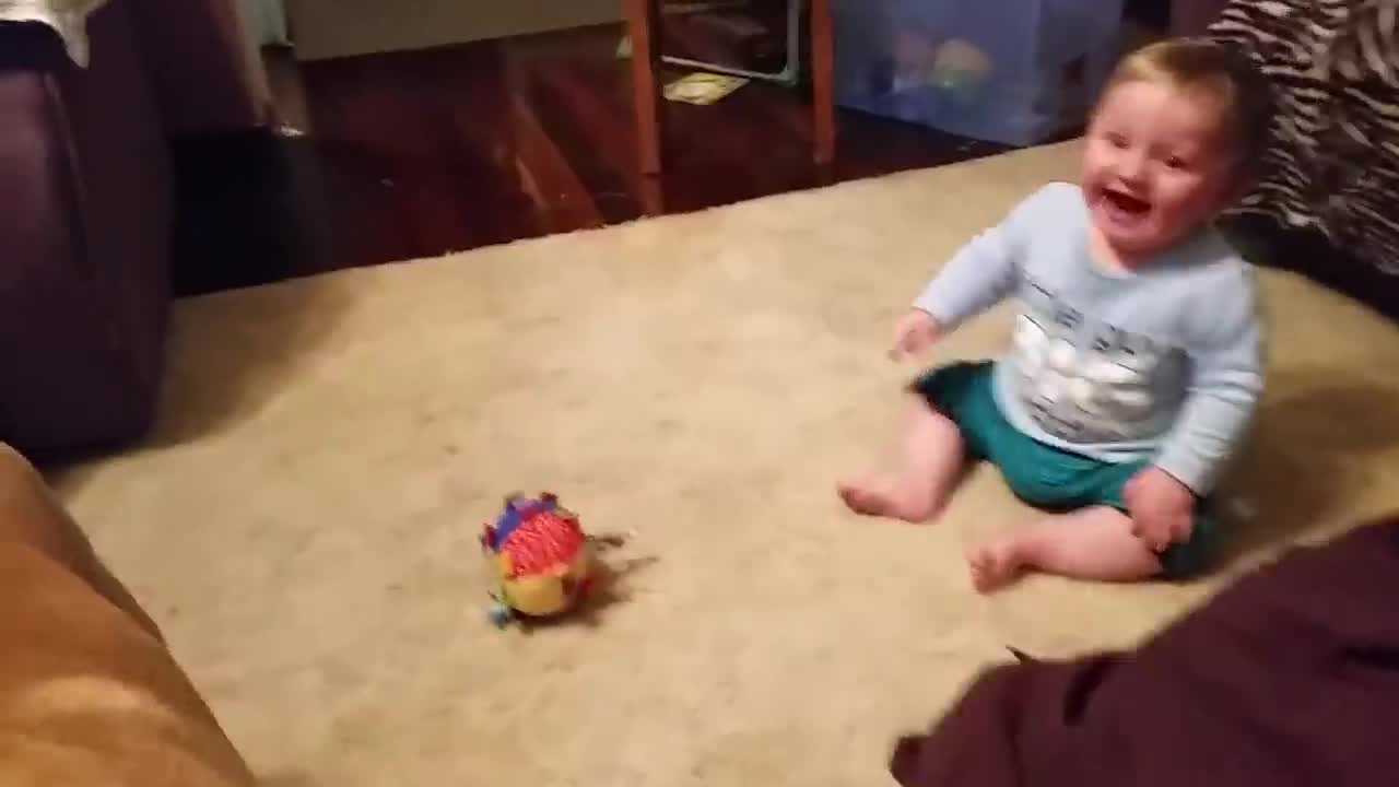 Baby laughing at dog & bubbles