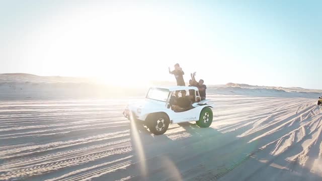 Two Vehicles Traveling In The Desert!