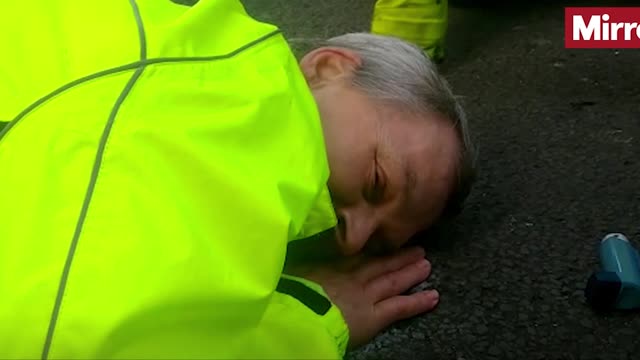 Insulate Britain protester glues his face to the road to stop himself from being removed