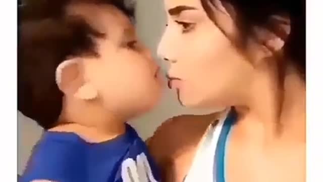 Cute baby kissing his mother.