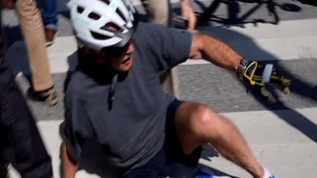 Joe Biden falls off the bike !!