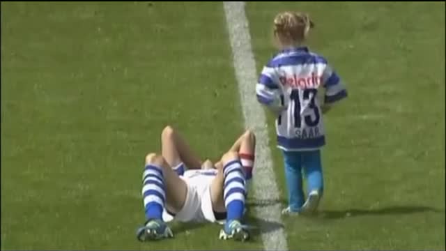 child comforting soccer player who was crying after missing the penalty