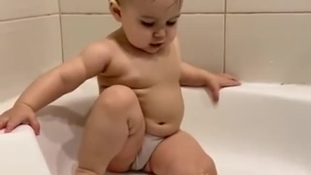 Cute chubby baby try to take a bath - Funny video