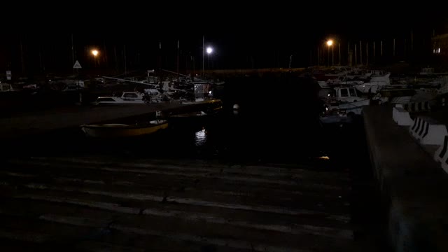 Night lights on the seaport - View from the wooden platform