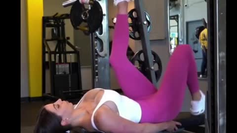 Spine workout with band for fitness girl