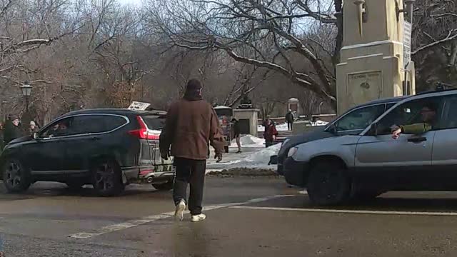 Car Drives through Protest in Regina