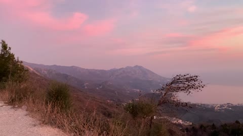 Sunset in the mountains with a very beautiful view of the sea and the city