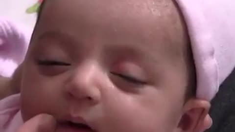 Baby girl laughing while she was sleeping