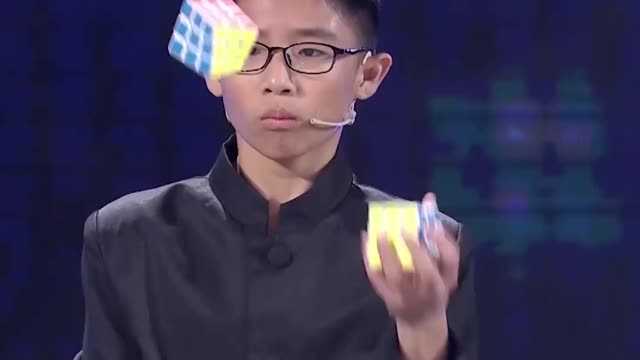 Fastest Time To Solve Three Rubik's Cubes Whilst Juggling - Guinness World Records