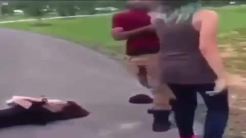 A BLACK KID WEARING BRASS KNUCKLES SUCKER PUNCHES A WHITE KID