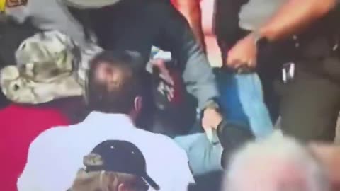 Video footage of an individual being dragged out from Trump's rally in PA