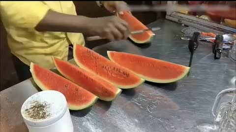 Amazing watermelon cutting skills .