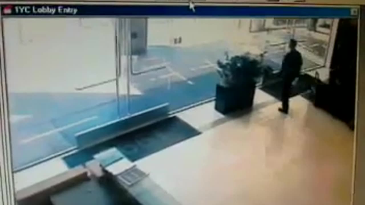 Man walking into glass