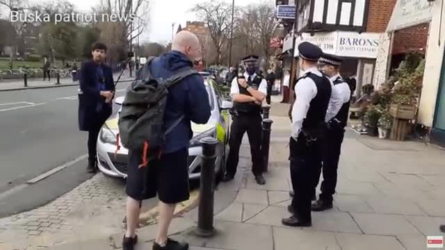 police moving on piers corybn and supporters leafleting out side TURNHAM GREEN STATION