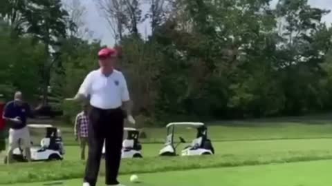 Trump playing golf...