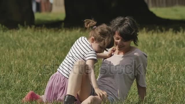 beby girl kissing her mother, slowmo footage.